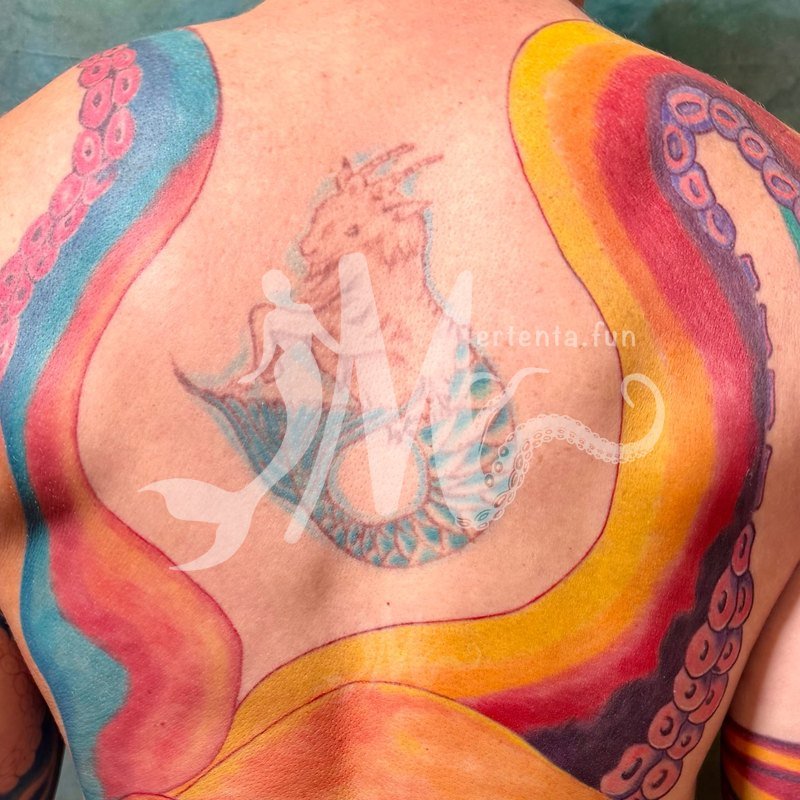 Mertenta's back tattoo
